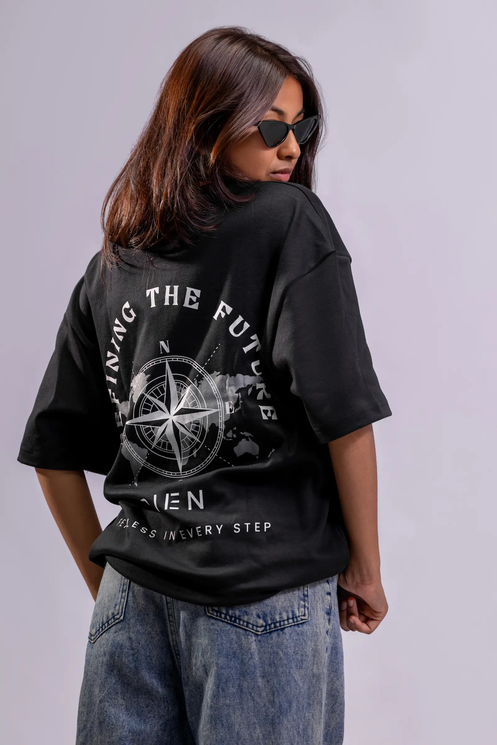 Model wearing a black Rien oversized tee