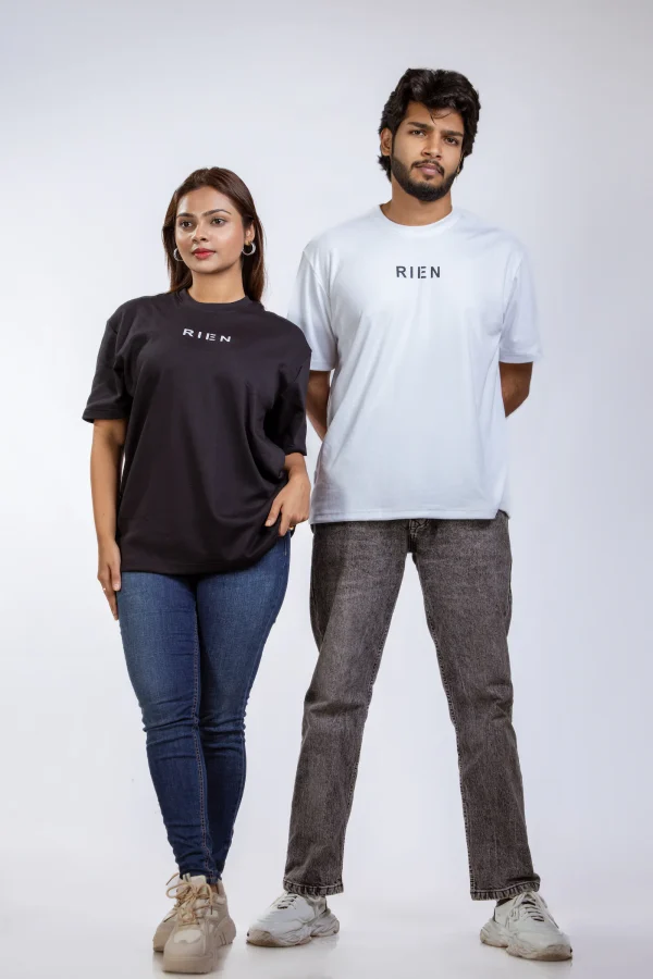 Rien Classic Oversized Tee in black and white, worn by a woman and a man